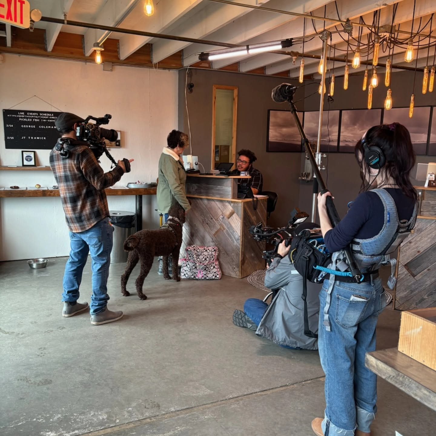 Jeremiah Rounds operating camera with The Columbia Coast crew during a cafe scene